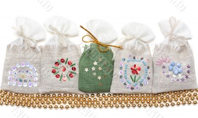 Bags with spice and golden necklace