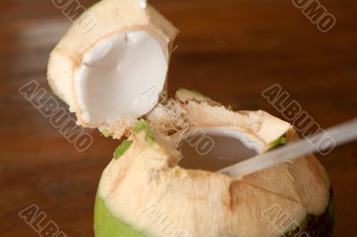 Open coconut with coco milk