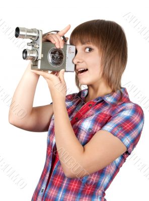 Girl in plaid shirt with movie camera
