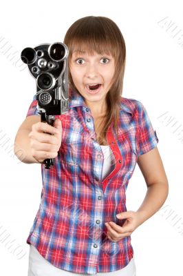 Girl in plaid shirt with movie camera