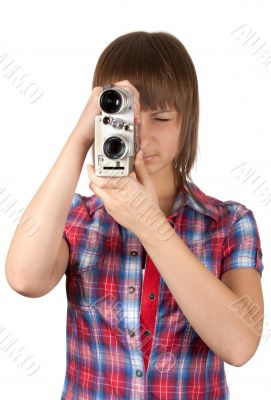 Girl in plaid shirt with movie camera