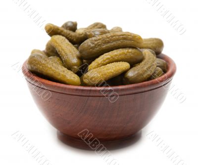 Wooden cup with salty cucumber