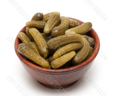 Wooden cup with salty cucumber