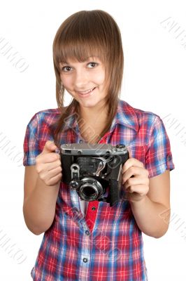 Beautiful young girl with old analog photo by camera