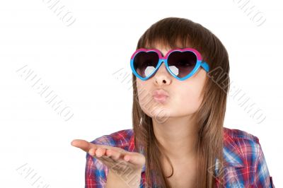 Portrait girl in sunglasseses sends air kiss