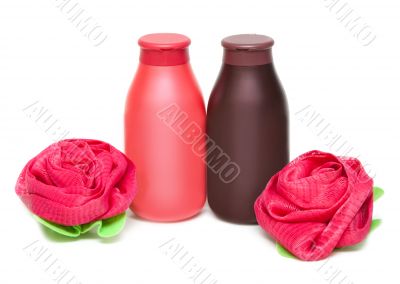 Two vials of the shampoo and sponge in form of the rose