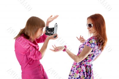 Two girls are taken pictures