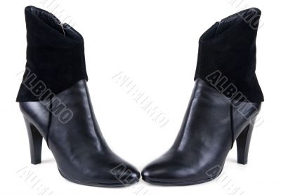 Black feminine leather boots with suede insertion