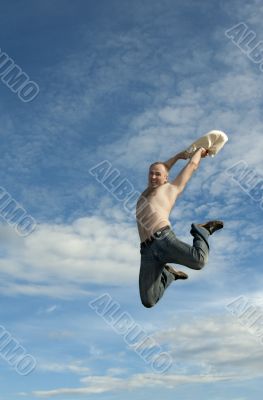 Man jumps on background sky