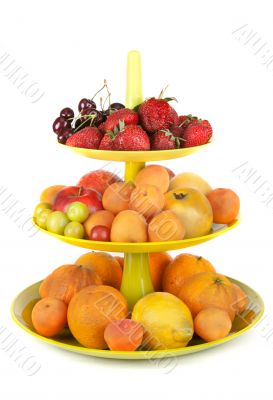 Fruits in green vase insulated on white background