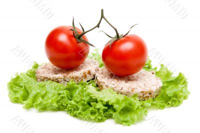 Two ripe tomatoes and small loaf of bread