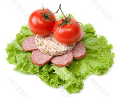 Sandwich with sausage, tomatoes and salad