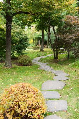 Path from stone in autumn park