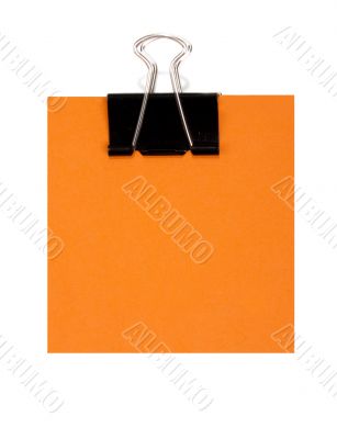 Orange note and black staple