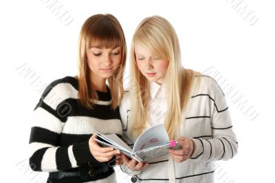 Two beautiful girls read diary book