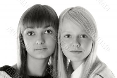 Portrait two girls of the blonde and brunettes monochrome