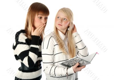 Two beautiful girls read diary book on white background
