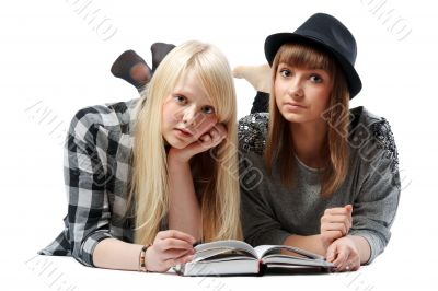 Two girls lies and read books Two girls lies and read books