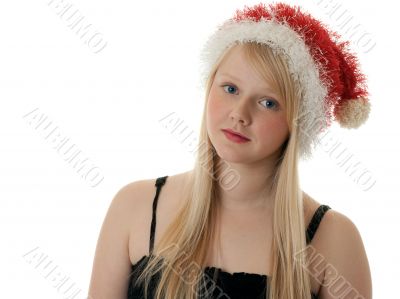 Beautiful blonde girl in a Santa hat