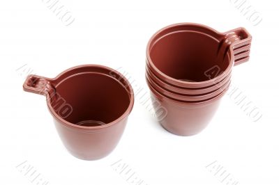 Five brown plastic cups