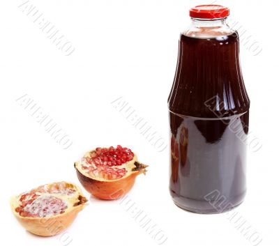 Bottle of juice and ripe piece grenade