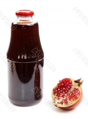 Bottle of juice and ripe piece grenade