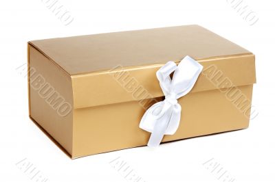 Golden gift box with a bow