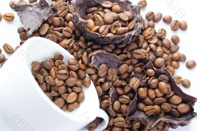 white cup with coffee beans