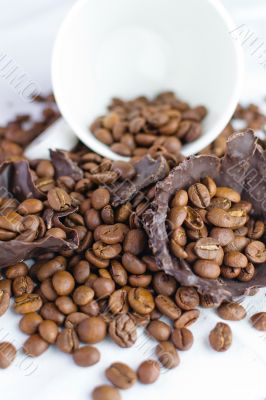 white cup with coffee beans