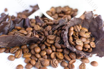 white cup with coffee beans