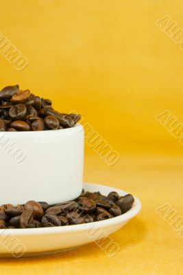 Cup full with coffee beans