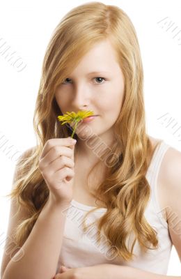 A pretty girl with a yellow flower, isolated