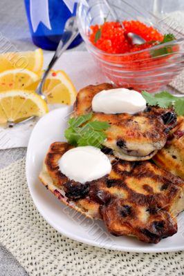 Fried pancakes with blackcurrant  