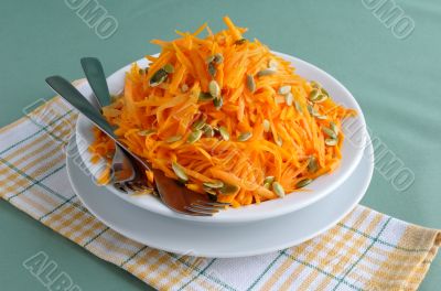 Salad of pumpkin and carrot with pumpkin seeds