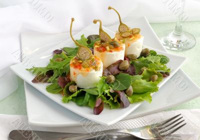 Cheese and capers sweet and sour sauce and pistachios