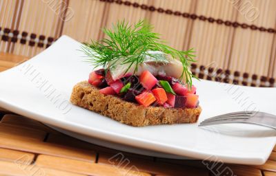 Sandwiches with rye bread, herring and vegetables