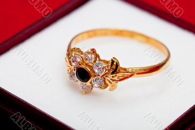 Gold ring with white and blue zirconia enchased