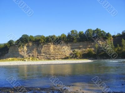 Bank of the river. Caucasus journey. Summertime.