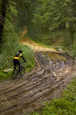 Biker crossing mud