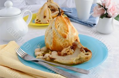 Stuffed with a mixture of nuts and raisins pear in puff pastry