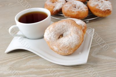 A cup of coffee and donuts