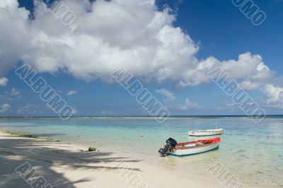 Fishing boat parked by deserted beach 
