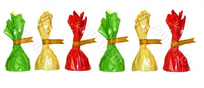 Chocolates in colorful wrappers, isolated on white Chocolates in colorful wrappers, isolated on white