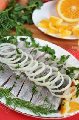 Appetizing herring with onions and oranges