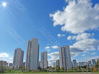 Cityscape with the sun. Summer Day 