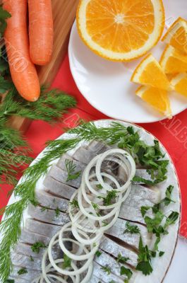 Appetizing herring with onions and oranges