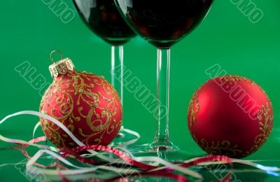 New Year`s still life - glasses of wine and Christmas balls