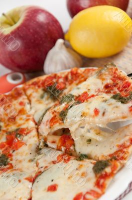 Appetizing pizza with mozzarella cheese and fruit
