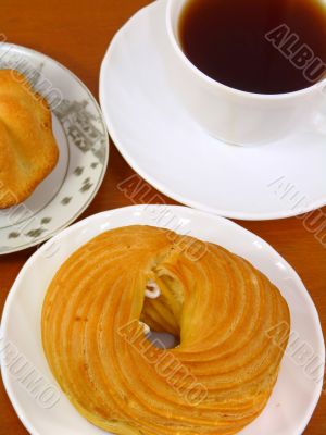 Tea and cake in isolation on a white background Tea and cake in isolation on a white background