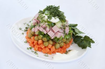 A delicious salad with mayonnaise isolated on a white background